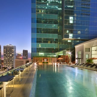 Pool Hotel Beaux Arts, Autograph Collection with sky in the background in the night