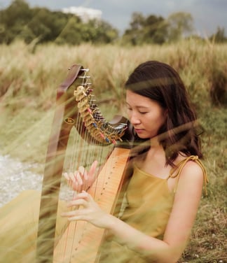 Photoshoot at Jurong Lake Park with an Aoyama lap harp, which is often used in ensemble performances