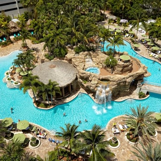 aerial view of the Seminole Hard Rock Hotel and Casino pool with people on an afternoon of recreation