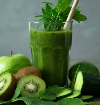 glass of kiwi fruit and whey smoothie