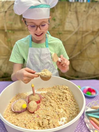 Enjoy sensory play adventures like baking cupcakes with sprinkled vanilla cloud dough!