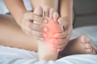 a woman with a painful foot pain