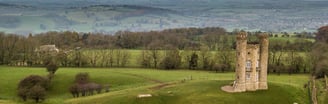 an aerial view of Broadway Tower with rolling hills beyond