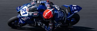 a person riding a motorcycle on a track