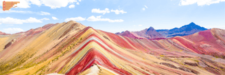 a rainbow - colored mountain in Peru
