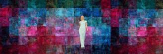 a woman in a white dress standing in front of a colorful background