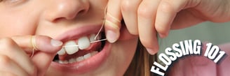 a girl is holding dental floss depicting flossing