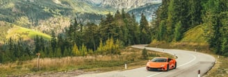 Lamborghini in front of landscape