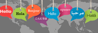 speech bubbles in different colours saying "hello" in different languages on a gray worldmap in the background
