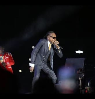 Vybz Kartel in a performance on stage.