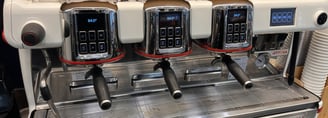 La Cimbali M100 Attiva espresso machine triple grouphead front view