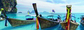 a number of boats on the water in phi phi island