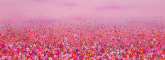 a field of flowers with a pink sky in the background