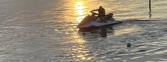 a man riding a jet ski in the water