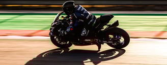 a person riding a motorcycle on a track