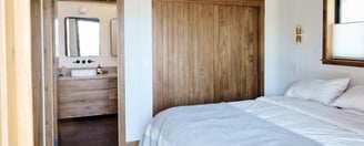 Cozy prefab modular tiny home bedroom with wood accents