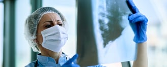 Nurse looking at the x-ray report