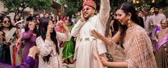 a man and woman dancing at a wedding