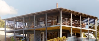 a house wooden with a large deck
