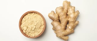 Ginger and bowl with ginger powder on white background