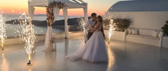 Romantic stage fireworks illuminating the couple’s first dance at a stunning Santorini wedding.