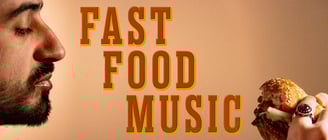 A bearded man gazing at a half-eaten cheeseburger, with a title art reading ‘Fast Food Music’