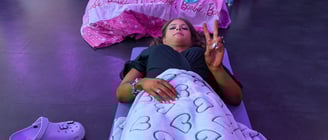a woman laying on the floor in a room
