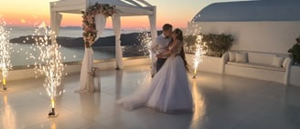 Spectacular stage fountain fireworks display lighting up a wedding reception in Santorini.