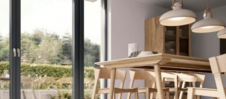 a dining room with a table and chairs