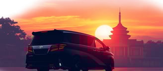 Luxury black van driving past traditional Thai pagoda at sunset in Bangkok