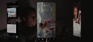 a man is laying in bed and holding a cell phone with social media apps running in front