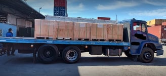 a truck with a load of wood pallets on it