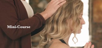 woman with hands on wowan's head