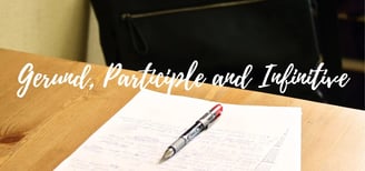 a pen and a pen on a desk with a pen and paper
