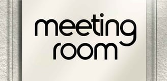 a sign that says meeting room