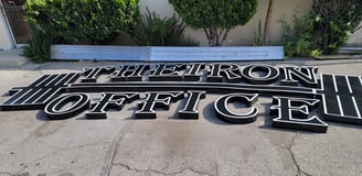 a sign that says Therion Office