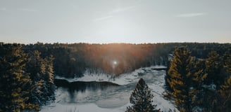 a river with a sun shining through the trees, Canada Nature