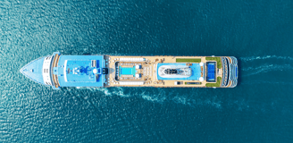 a large boat is traveling down the water