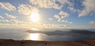 the island of la graciosa from mirador del rio in the sunset