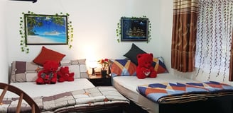 Family room at Nobel Bungalow Nuwara Eliya with double beds and red teddy bears