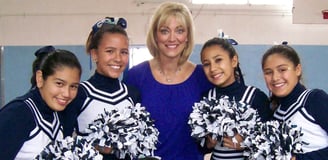 Angie Crouch with high school cheerleaders 