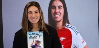 a woman holding a book about a woman's life