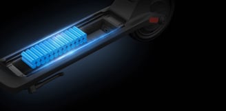 a blue and black electric scooter with a blue light