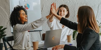 group of business women working together to achieve financial goals