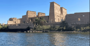 Aswan cityscape showcasing temples, the Nile, and the High Dam.