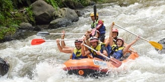 a group of people on raft raft raft rafting down a river