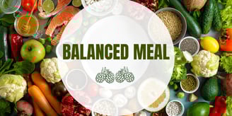 A variety of fresh produce including spinach, cherry tomatoes, and carrots, ideal for balanced meal