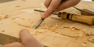 a person is sharpering a knife in a woodworking