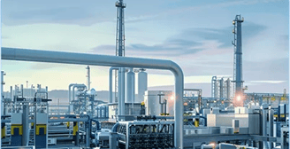a large industrial steel pipework with a view of a refinery