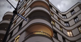 a tall building with a street light and a street light